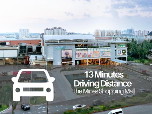 a building with a parking lot with a bus at Smile Hotel C180 Cheras Selatan in Cheras