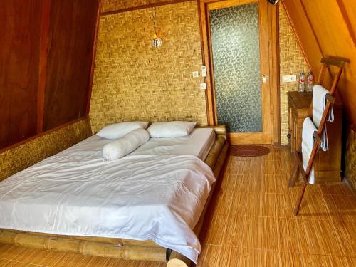 Postel nebo postele na pokoji v ubytování Muni's Terrace Bungalow