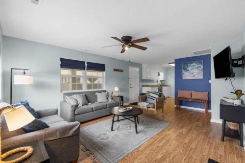 a living room with a couch and a table at *COMFY N. MYRTLE HOUSE*3 NEW Queens*Steps to the Beach*V384 in Myrtle Beach