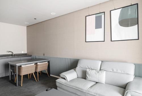 a living room with a couch and a table at Daynice hotel in Boryeong