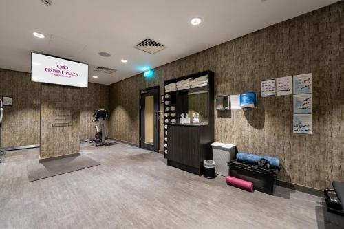 a waiting room with a sign on the wall at Crowne Plaza Aberdeen Airport by IHG in Dyce
