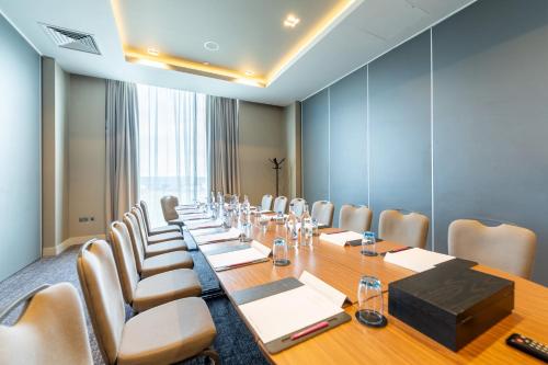 a conference room with a long table and chairs at Crowne Plaza Aberdeen Airport by IHG in Dyce