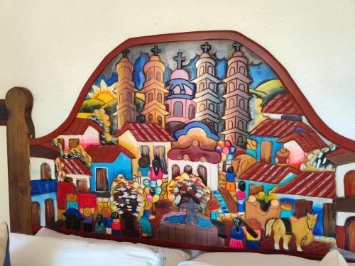 a painting of a disney castle on a headboard at Casa de las Conchas Cuernavaca in Cuernavaca