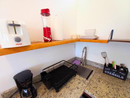 a kitchen counter with a sink and a sink at Javiellie Luxury Villa in San Ignacio