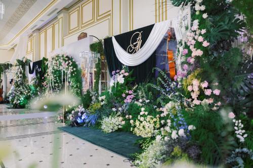 a display of flowers on the side of a building at Dalat Palace Heritage Hotel in Da Lat
