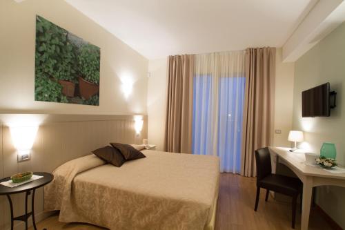 Postel nebo postele na pokoji v ubytování Agriturismo Ai Prati
