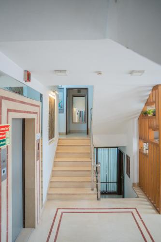 a hallway with stairs in a house at Ahuja Residency DLF Phase 2 in Gurgaon