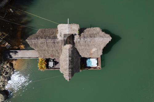 an aerial view of a bridge in the water at Ibuku Hotel Guatapé - Chalets in Guatapé