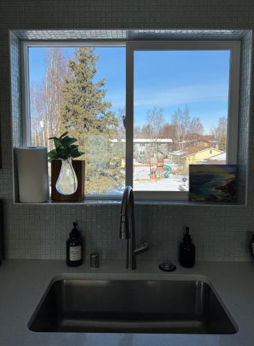 a kitchen sink with a window in a kitchen at City Retreat, 2bdrm near Airport in Anchorage