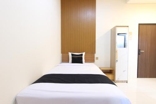 Кровать или кровати в номере Collection O Solo near Universitas Muhammadiyah Surakarta formerly Kedaton Home