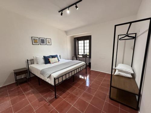 a bedroom with a bed and a mirror at The Boat House Suites in Cancún