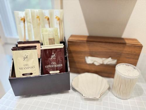 a box ofodorizers and a wooden box ofumedumedumed at グランピング宿 星空テラス&暖炉の庭付き戸建 Orion in Miyamae