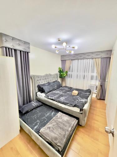 Ένα ή περισσότερα κρεβάτια σε δωμάτιο στο Seawind Condominum Unit 4M