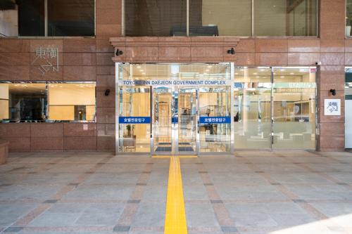 an entrance to a building with a glass door at Toyoko Inn Daejeon Government Complex in Daejeon