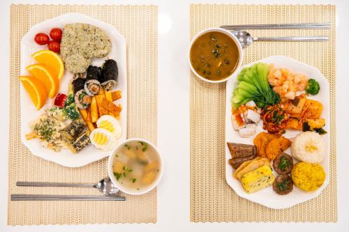 two plates of food with different types of food at Toyoko Inn Daejeon Government Complex in Daejeon