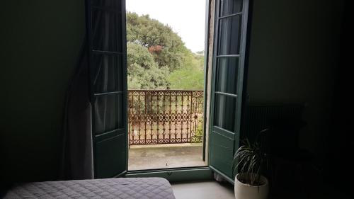 an open window with a view of a fence at Pradines in La Celle-sous-Gouzon