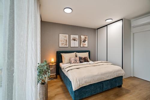 a bedroom with a large bed in a room at Apartmány Klement in Znojmo