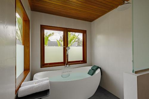 Ένα ή περισσότερα κρεβάτια σε δωμάτιο στο Green Weca Ubud Villa