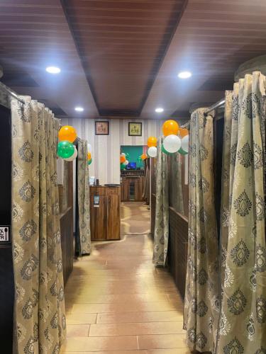 a hallway with drapes in a room with at New city guest house in Bihār Sharīf