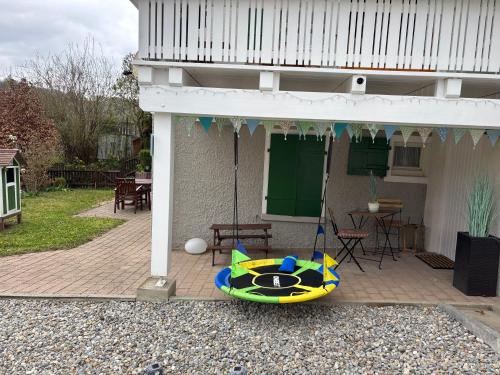 a kayak sitting on the side of a house at Ferienwohnung Erwin in Zwiefalten