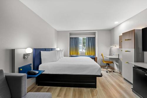 Ένα ή περισσότερα κρεβάτια σε δωμάτιο στο Microtel Inn & Suites by Wyndham Norcross