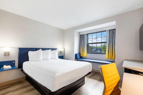 Ένα ή περισσότερα κρεβάτια σε δωμάτιο στο Microtel Inn & Suites by Wyndham Norcross