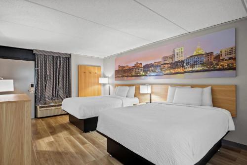 Ένα ή περισσότερα κρεβάτια σε δωμάτιο στο Days Inn by Wyndham Statesboro