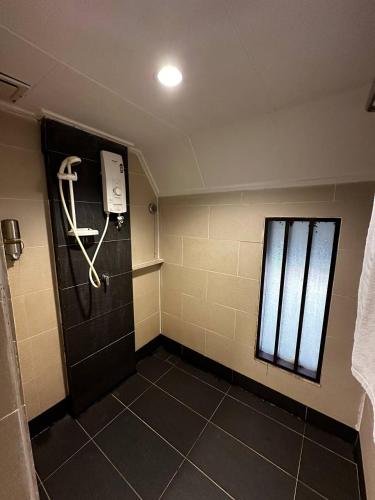 a bathroom with a door with a skeleton on it at National Park Mutiara - Kuala tahan in Kuala Tahan