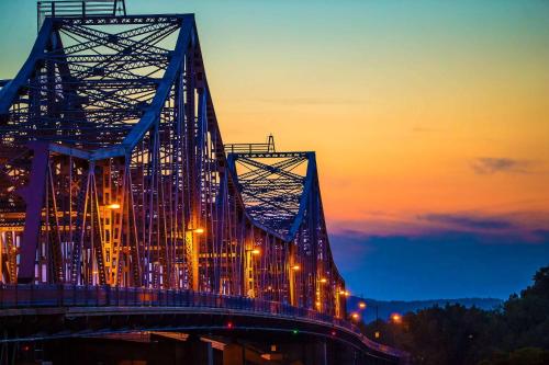 a large bridge with lights on it at sunset at Radisson Hotel La Crosse in La Crosse