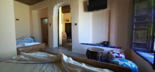 Un ou plusieurs lits dans un hébergement de l'établissement Riad zineb