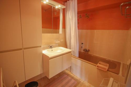 a bathroom with a sink and a shower and a tub at Locaspera in Spéracèdes