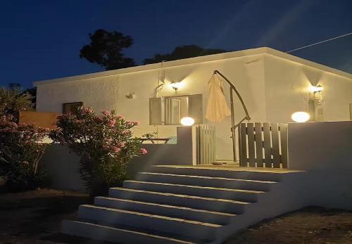 a set of stairs leading to a house at night at Manos' Dream in Empourios