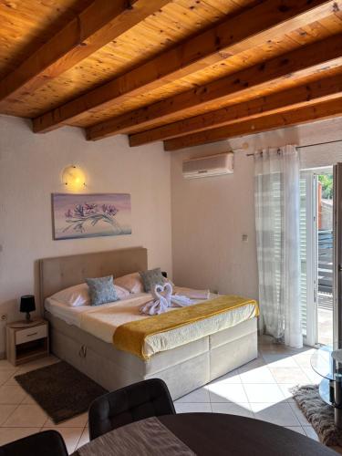 Postel nebo postele na pokoji v ubytování Apartmani Nil