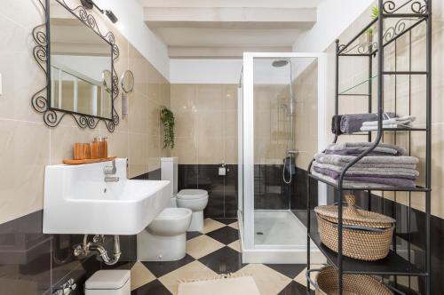 a bathroom with a sink and a toilet and a shower at Villa Jona in Žužići