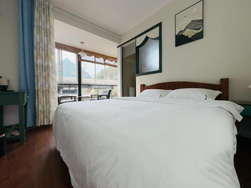 Postel nebo postele na pokoji v ubytování Xunyan B&B