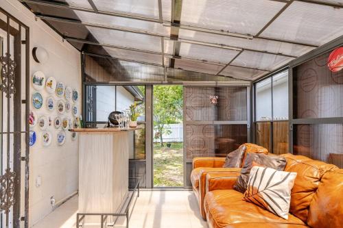 a living room with a couch and a table at Tampa Stadium Vacation Rental in Tampa