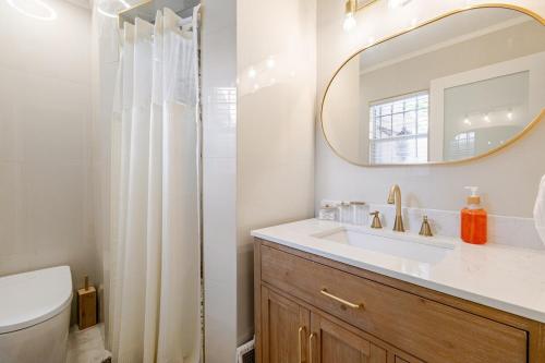 a bathroom with a sink and a mirror at Tampa Stadium Vacation Rental in Tampa