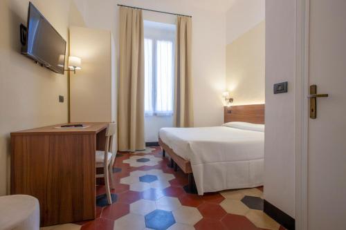 Postel nebo postele na pokoji v ubytování Hotel Palace