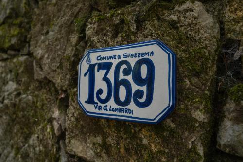 a license plate on the side of a rock at Villa Marisa in Stazzema