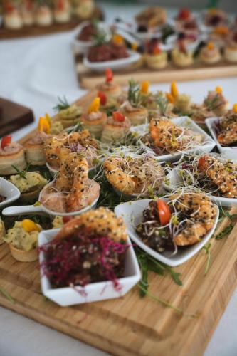 a tray of different types of food on a table at Hotel Matija Gubec in Stubicke Toplice