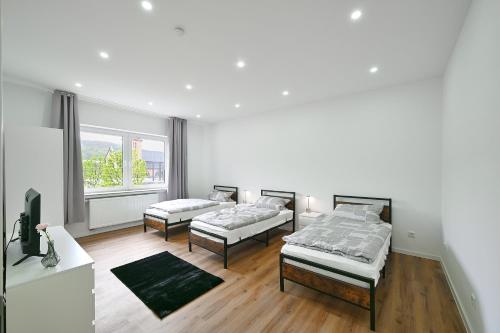 Postel nebo postele na pokoji v ubytování BetonTraum Apartment