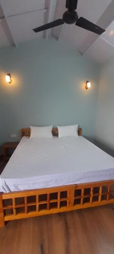Ένα ή περισσότερα κρεβάτια σε δωμάτιο στο Mountara Homestay