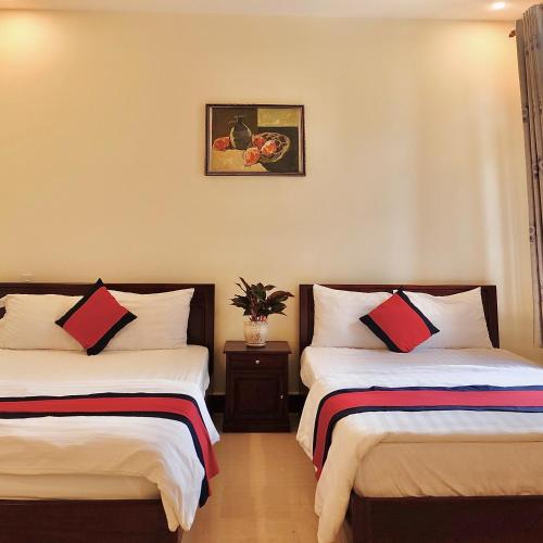 Postel nebo postele na pokoji v ubytování An Lộc Hotel