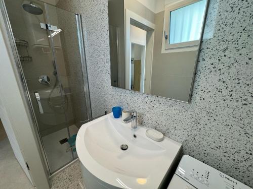 Ένα μπάνιο στο App4rent Villa Zanetti - Appartamenti con spiaggia privata frontemare