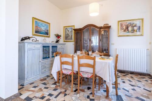 a dining room with a table and chairs at Casa Graziella the top holiday home in Ugento