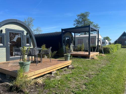 Κήπος έξω από το Camping Kleine Belterwijde, Pod, Tiny House aan het water