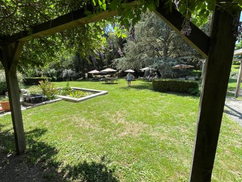 a garden with a person walking in the grass at Cantaranne in Privezac