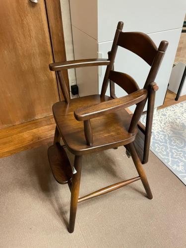 a wooden rocking chair sitting in a room at Kamakura Jomyoji Terrace-鎌倉浄明寺テラス- in Kamakura