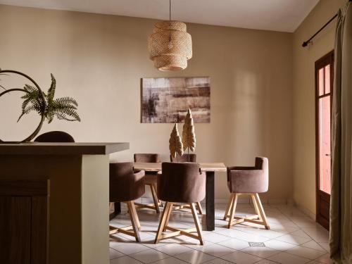 a dining room with a table and chairs at Sea Elegance Villa - On the Beach, by ZanteWize in Zakynthos Town