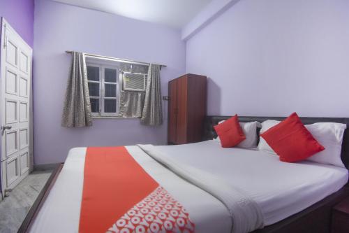 Postel nebo postele na pokoji v ubytování Hotel O RS Guest House